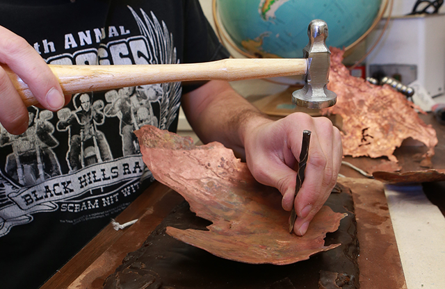 Ben Mark hammering continent out of copper