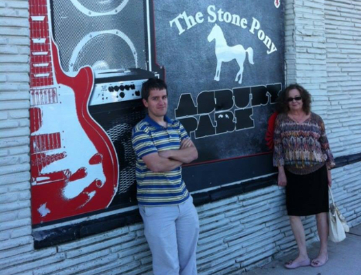 Kate poses with graduate student outside the Stone Pony in Asbury Park, New Jersey.