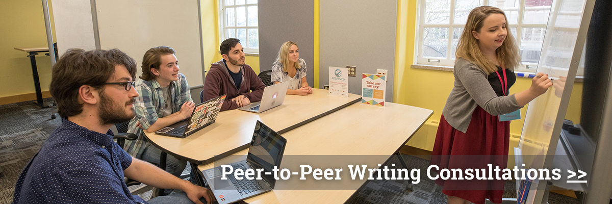Click to learn about peer-to-peer writing consultations. Graphic shows four student consultants gather at a table in the Howe Center for Writing Excellence. They watch another consultant write on a whiteboard.