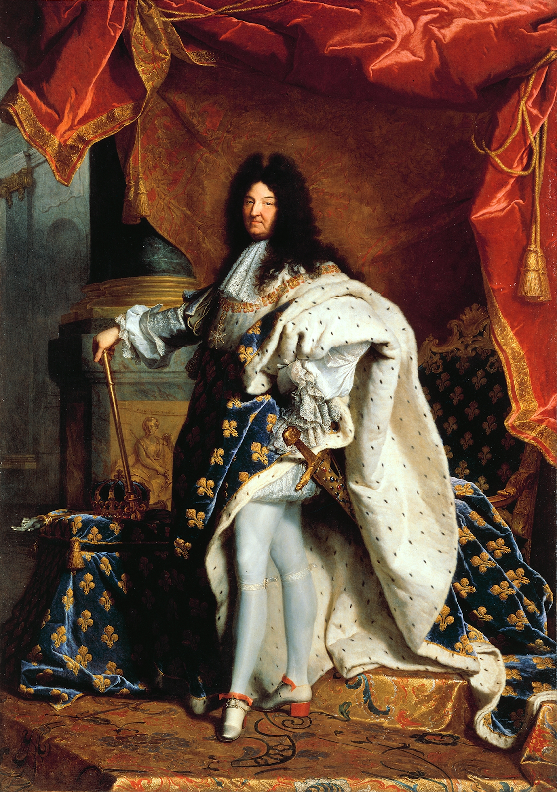 Painting titled "Louis XIV" by Hyacinthe Rigaud. Louis XIV stands in front of a red velvet curtain, ornate column, dressed in white tights and an ermine and blue velvet robe, embroidered with gold fleur de lis. He holds a straight cane. An ornate sword is belted at his side. His crown sits on a small table covered with the same material as the cape.