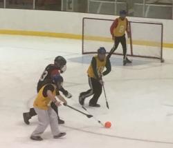 IT Services Broomball players on the ice