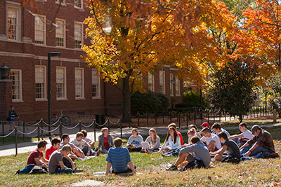 Students enjoy a classroom outside during a sunny day at Miami.