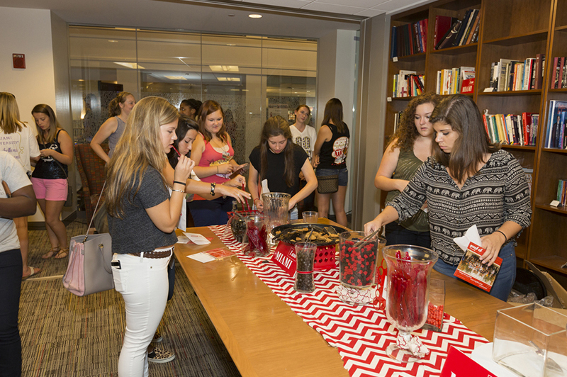 Students fill up bags at a candy bar