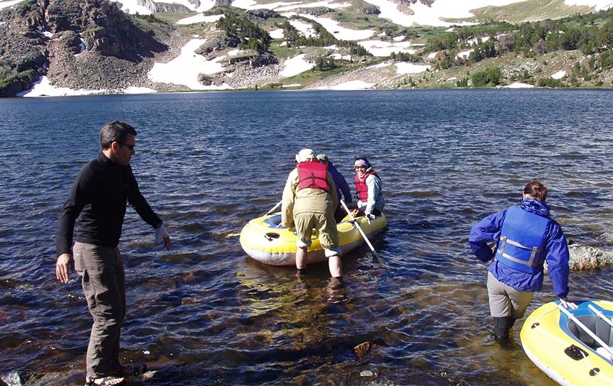 Miami graduate and undergraduate students work with Craig Williamson, professor of biology, to collect samples from a high-elevation lake in Montana's Beartooth Mountains for Williamson's research on the effects of climate change on a series of alpine lakes. 
