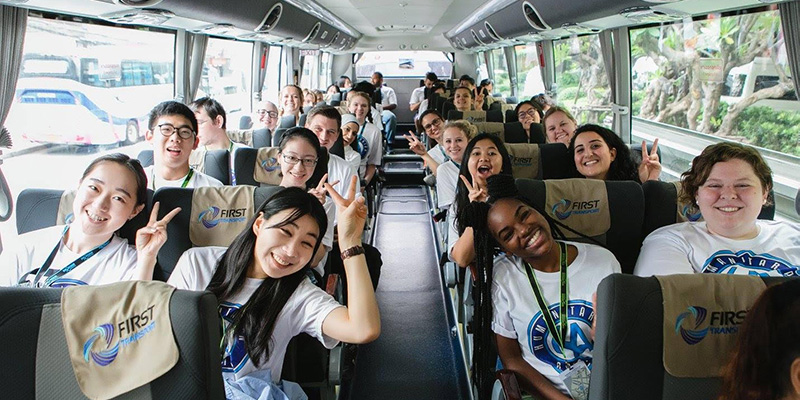 Students touring Bangkok by bus.