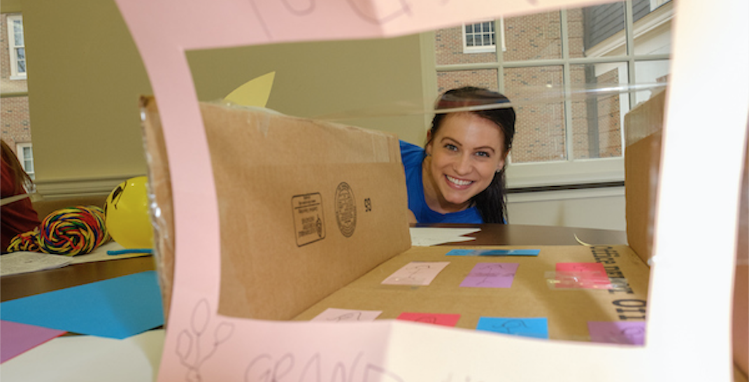 A Miami University business student shows off her creation during a marketing project.