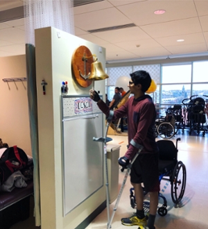 Prasidh Arora rings the bell at his rehabilitation center.