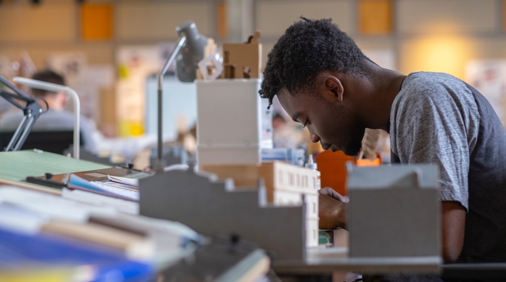 Student working on architecture project in the studio at Alumni Hall.