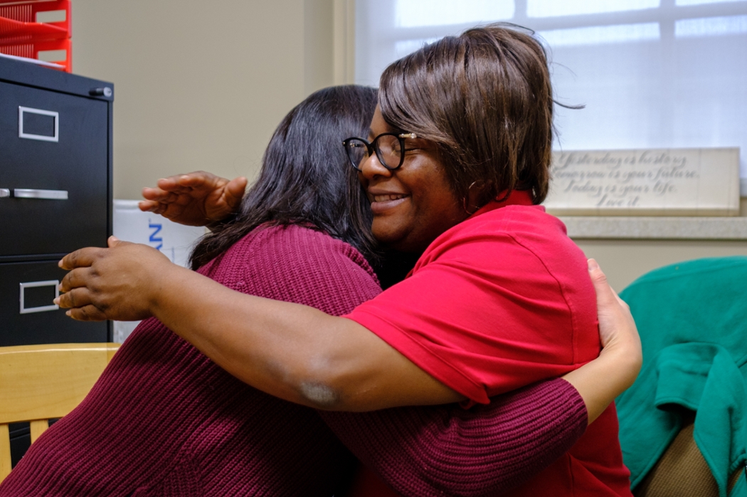 Addie and her Miami mentor, Kim Collins, share a hug.