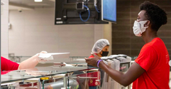 student getting meal at dining location