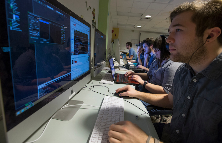 digital game design students look into computers