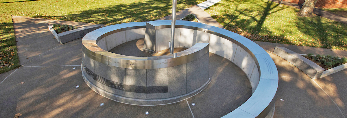 The completed tribute memorial, two granite and metal intertwining walls, etched with the names of Miami veterans.