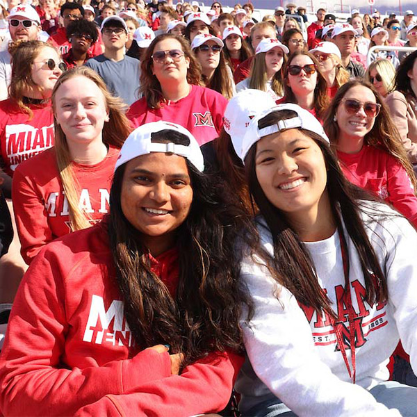 students in the stands at a sporting event