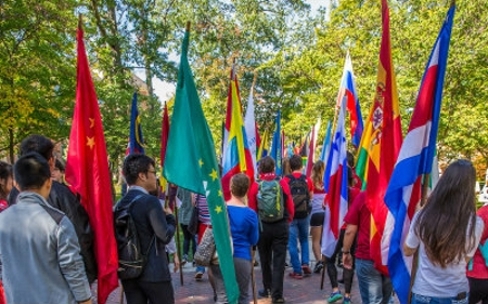students carrying flags at the hub