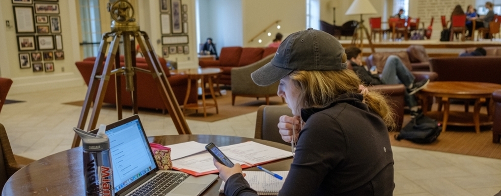 Students studying in the Armstrong Shade Family Room