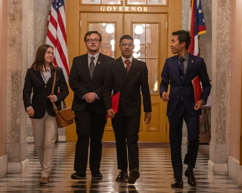 aspire students walking in hallway of state house