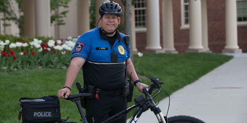 Police Officer on police bike on campus
