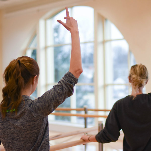 student performing barre exercises