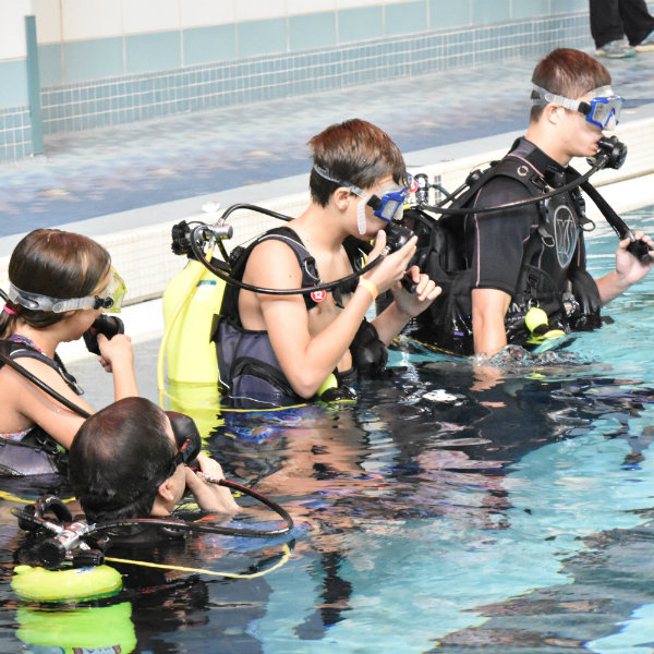Kids prepare to scuba dive