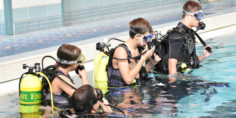 Kids prepare to scuba dive