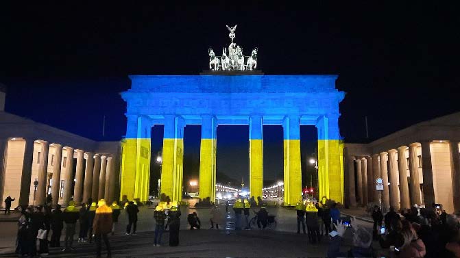 Brandenburg Gate located in Berlin lit up with Ukrainian flag colors