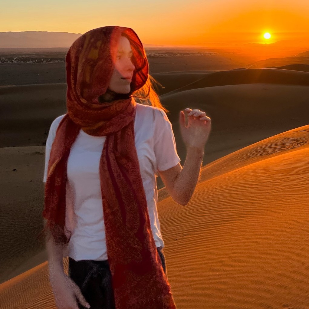 Megan Foster in desert at sunset