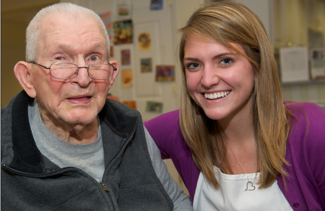 An elder with dementia and his volunteer partner from Opening Minds through Art