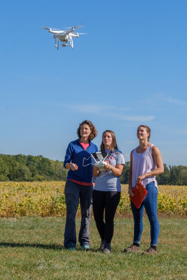 students flying a drone
