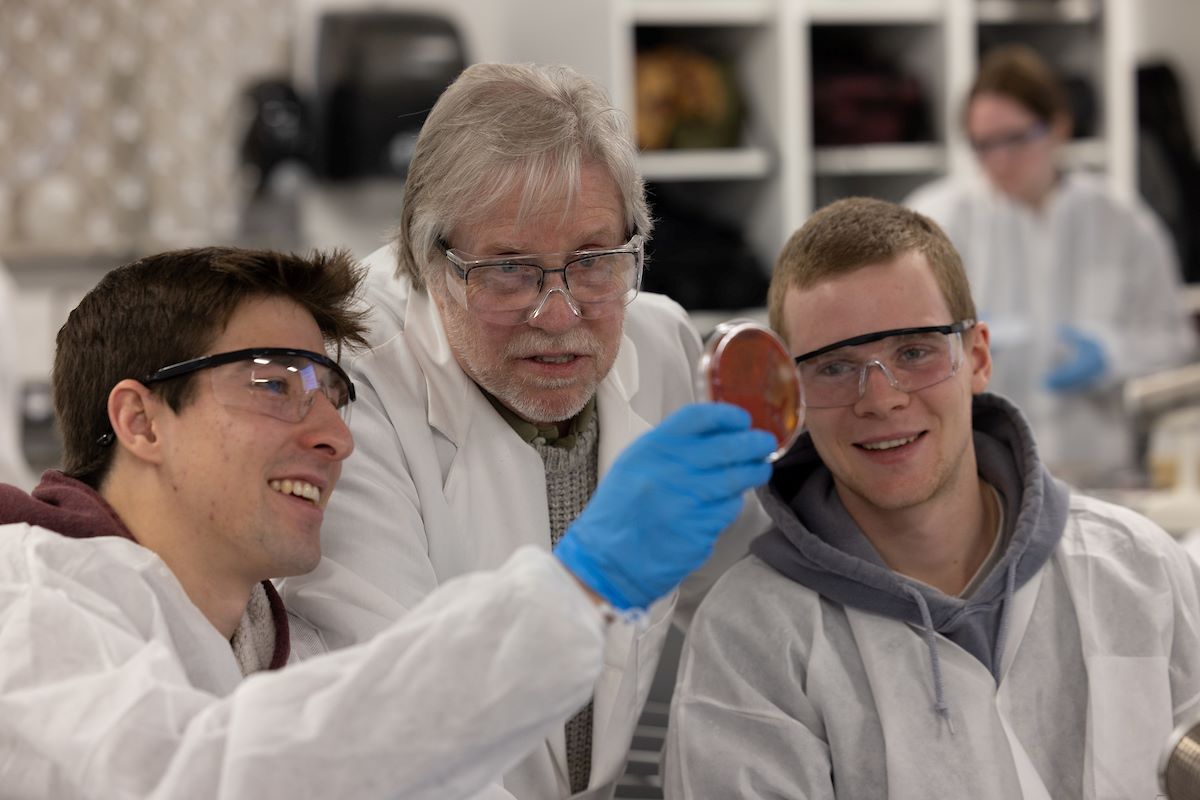 Students working directly, showing their work, to Professor Joe Carlin