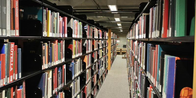  A view of library shelves along an aisle