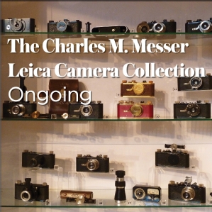Shelves of Leica cameras on display. Text 'The Charles M. Messer Leica Camera Collection, Ongoing'