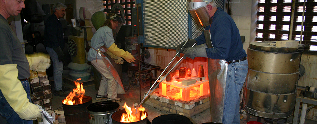 Students and teacher cast bronze in a fire