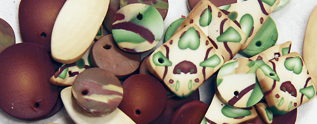 Polymer clay beads arranged on a surface
