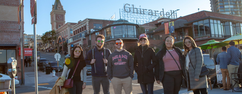 group of students pose near the Ghirardelli building, San Francisco