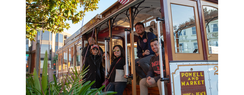 Students pose on a cable car