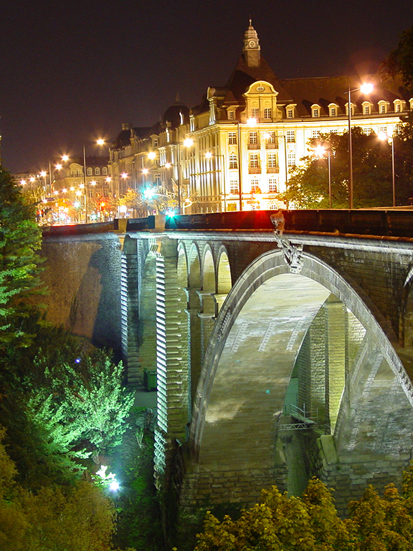 A nighttime view of the bridge and Luxembourg City