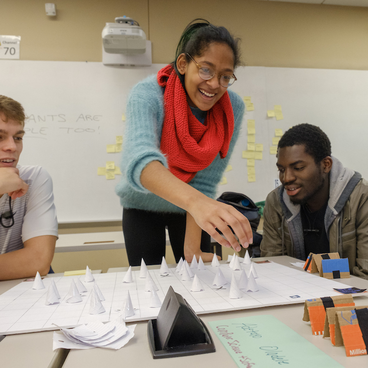 Students in a design thinking class play a game