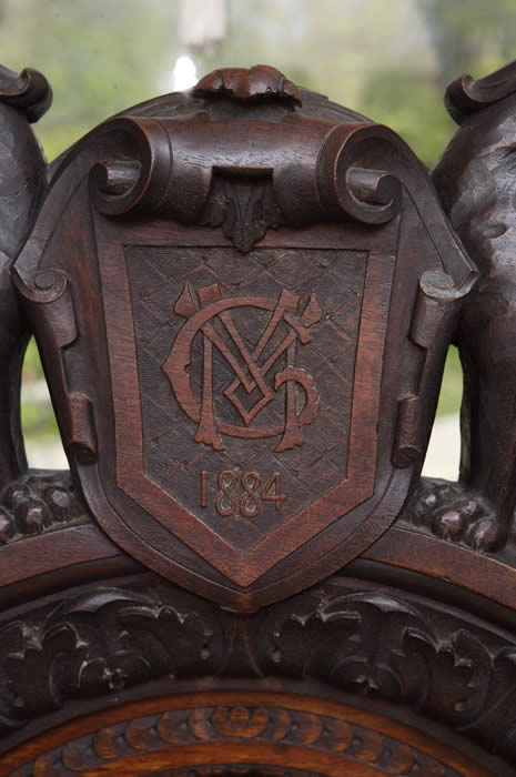 Detail of Alexander McGuffey's Hand Carved Emblem on Chair