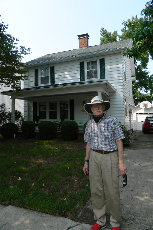 John Clover outside house