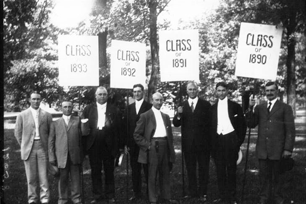 1890s commencement with men holding class signs