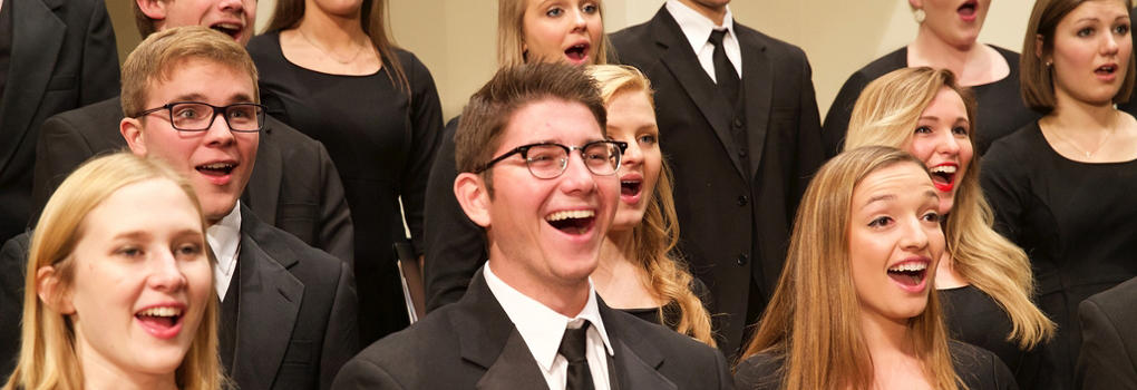 Combined Glee Club and Chorale singers perform with enthusiasm at Hall Auditorium 