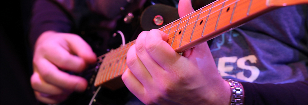  Closeup of a jazz guitarist's hands during a performance