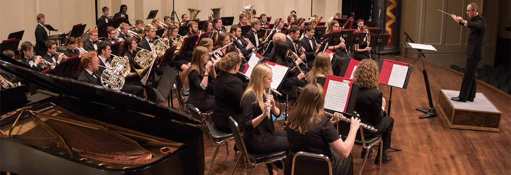 Symphony Band performing onstage at Hall Auditorium