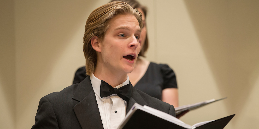  A closeup of a Chamber Singers male performer