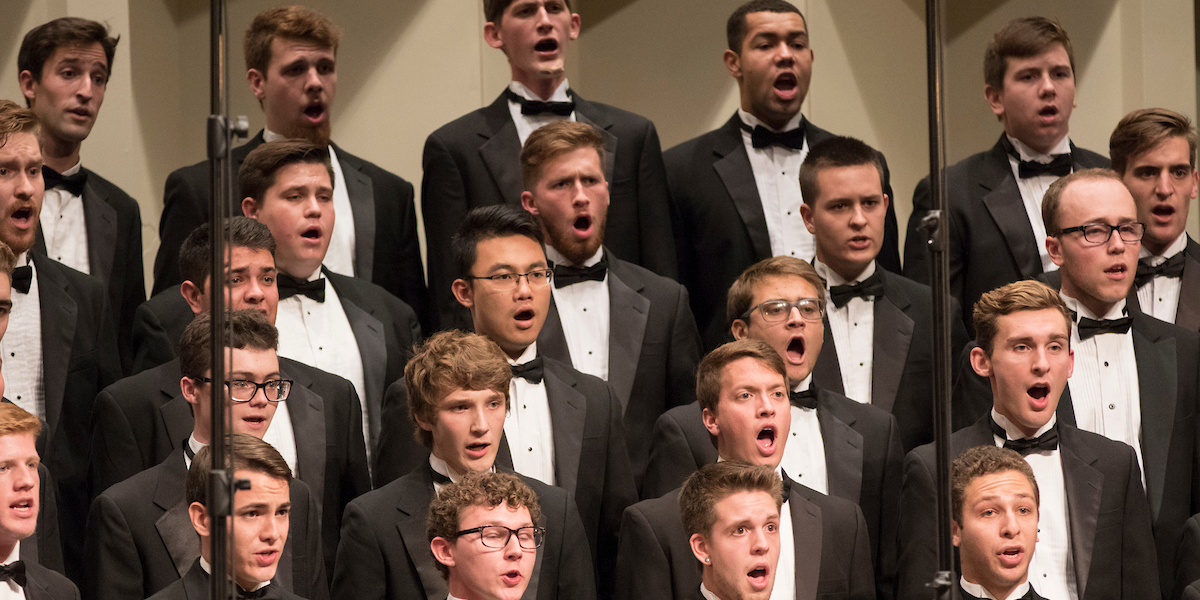 Closeup of a section of singers in the mens glee club concert 