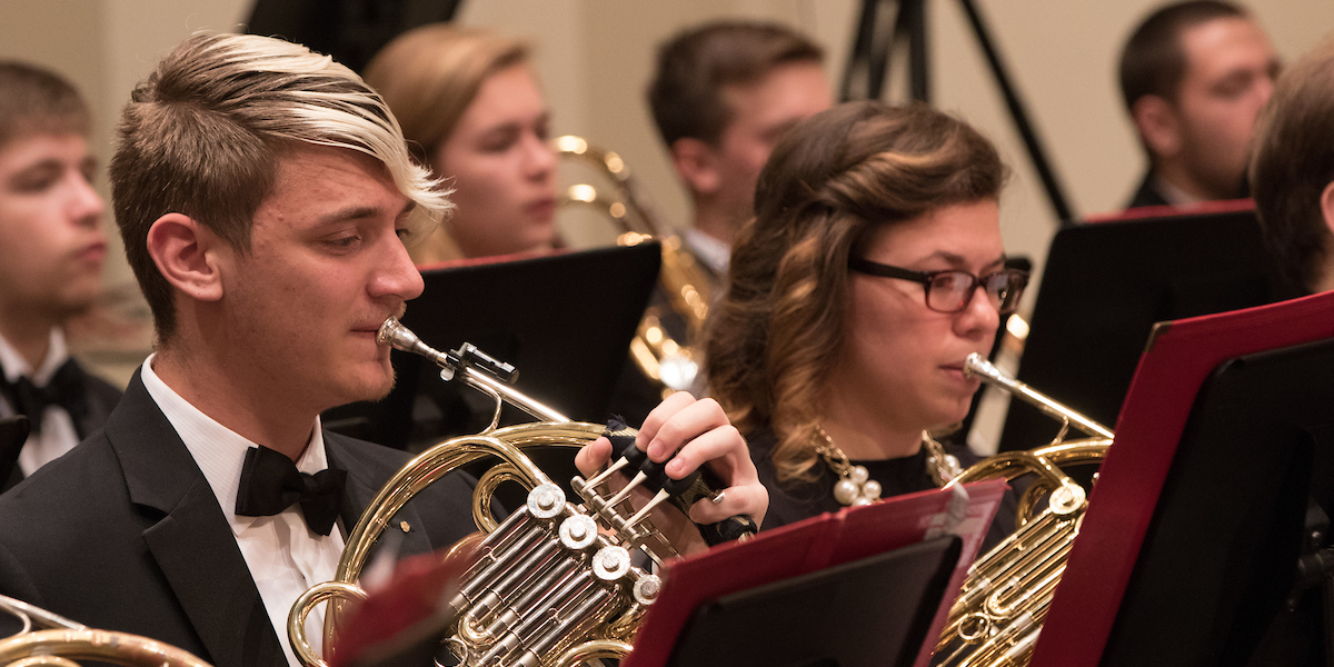  Closeup of horns playing in symphony band concert at Hall Auditorium