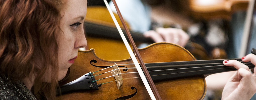  A closeup of a violinist during Morpheus chamber orchestra rehearsal