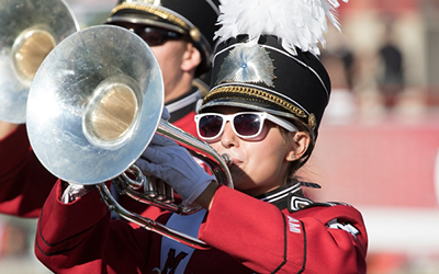 Miami Marching Band member performs on mellophone