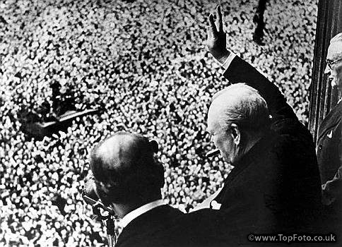 Prime Minister Winston Churchill gives his famous V for Victory sign to a crowd of 50,000 on VE day, May 8, 1945, from the balcony of the Ministry of Health, London. Learn more about Churchill as a leader, writer and artist during Churchill Week. 