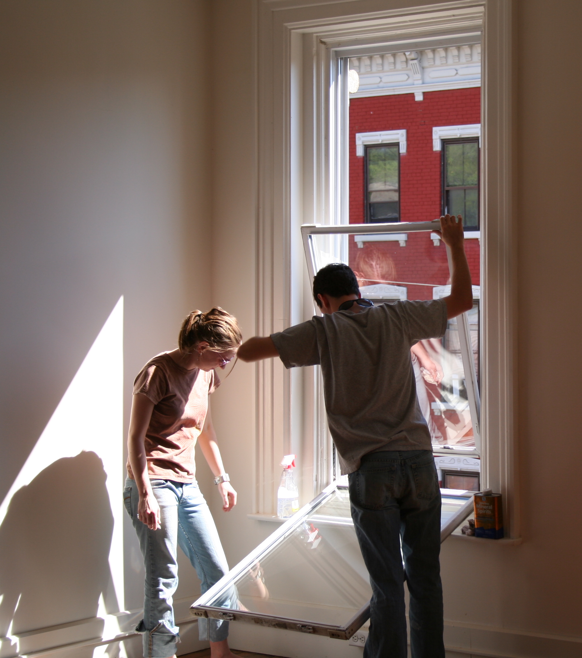 students installing a window at an Over-The-Rhine job site